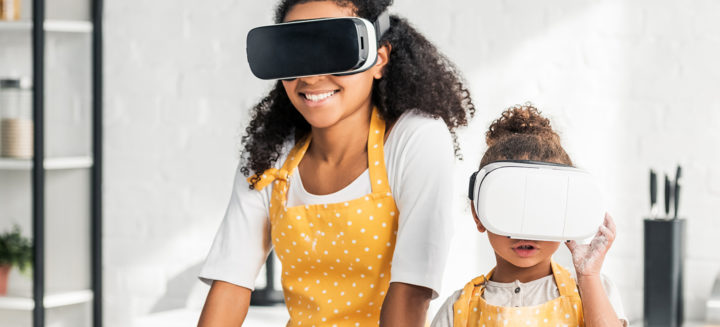 Mother & daughter cooking wearing VR glasses