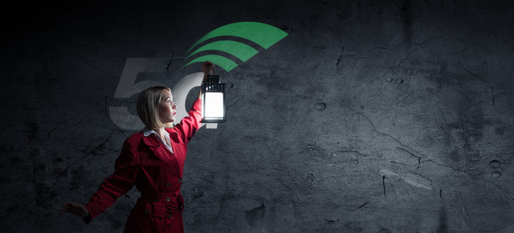 Woman with lantern searching 5G in darkness