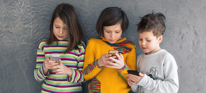 Kids looking at mobile phones