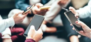 Friends group having fun using mobile smart phone - Close up of people hands sharing content with smartphone