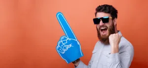Photo of a bearded man with big blue fan glove